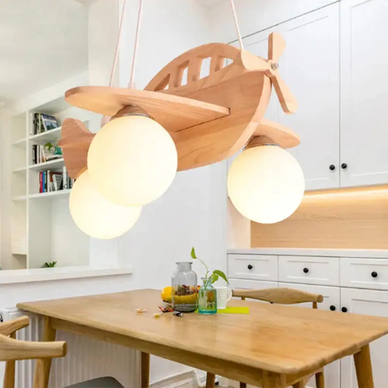 Decorbites led wooden aircraft kids chandelier featuring a wooden airplane pendant light with three frosted glass bulbs