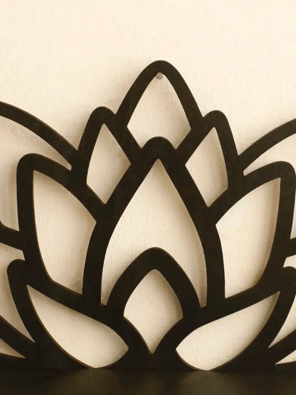 Black metal lotus floating wall shelf with sleek cut-out petal design for multi-style home decor by decorbites