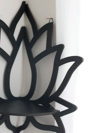 Black lotus floating wall shelf with sleek minimalist design and smooth matte finish for modern home decor