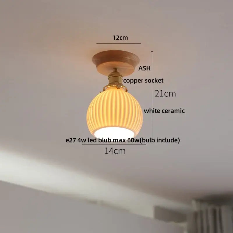 A warm-toned white ribbed ceramic ceiling light with copper socket and ash wood mount decorbites lotus glass led