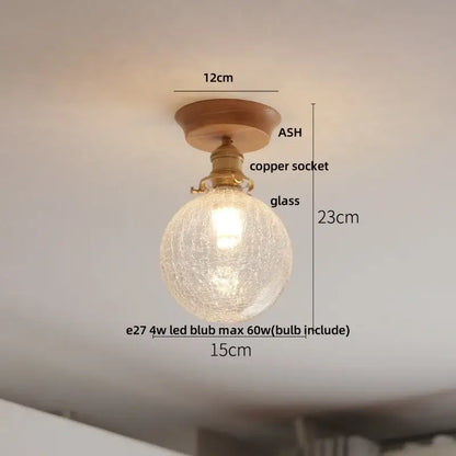 Decorbites lotus glass led ceiling light with warm-toned crackled glass globe, copper socket, and ash wood mount