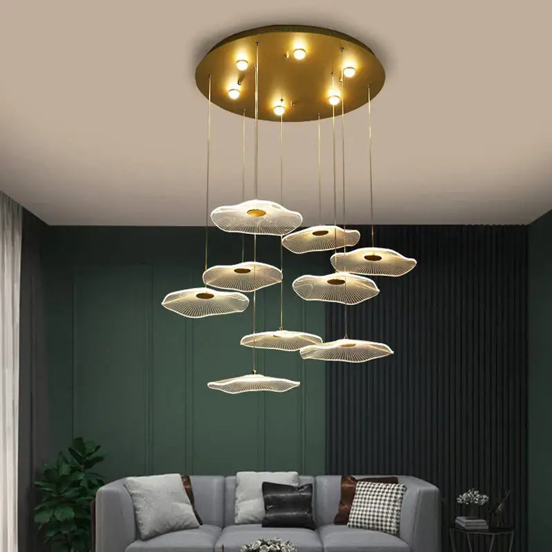 Gold-toned cloud-shaped acrylic pendant lights with modern minimalist design from decorbites lotus leaf led chandelier