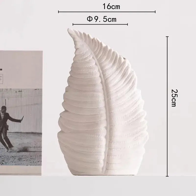 White ceramic decorbites lotus leaf vase with textured ridged surfaces for floral arrangement and room decoration