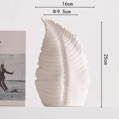 White ceramic decorbites lotus leaf vase with textured ridged surfaces for floral arrangement and room decoration