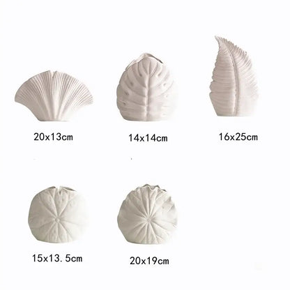 White ceramic decorbites lotus leaf vases in fan shell, broad leaf, and sea urchin shapes for floral arrangement