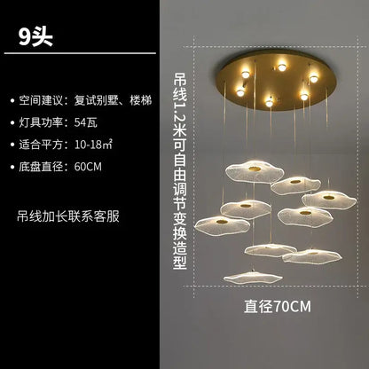 Gold-toned decorbites lotus leaf chandelier with nine cloud-shaped acrylic LED pendant lights for modern luxury interiors