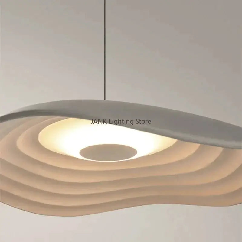 Modern LED pendant lamp decorbites lotus leaf chandelier with matte off-white concentric wave-like rings in minimalist design