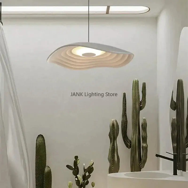 Modern white DecorBites Lotus Leaf chandelier with concentric wave-like ridges and warm LED glow for minimalist decor