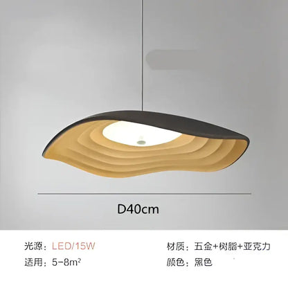 Black pendant light with layered gold-toned metal and acrylic wave design in decorbites lotus leaf chandelier style