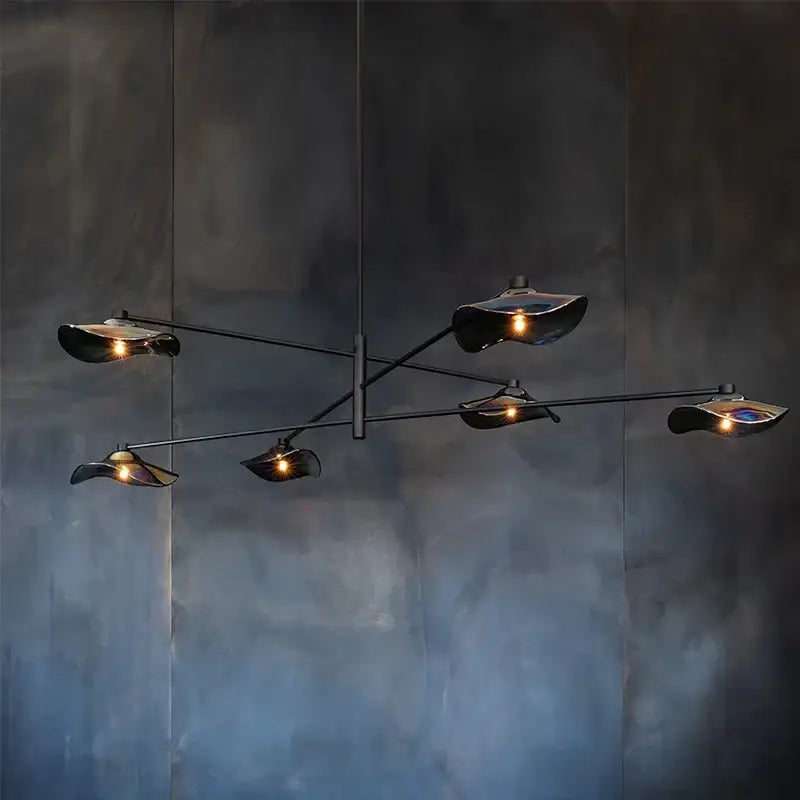 Modern black metal chandelier with five lotus leaf glass shades emitting warm light by DecorBites for living room lighting