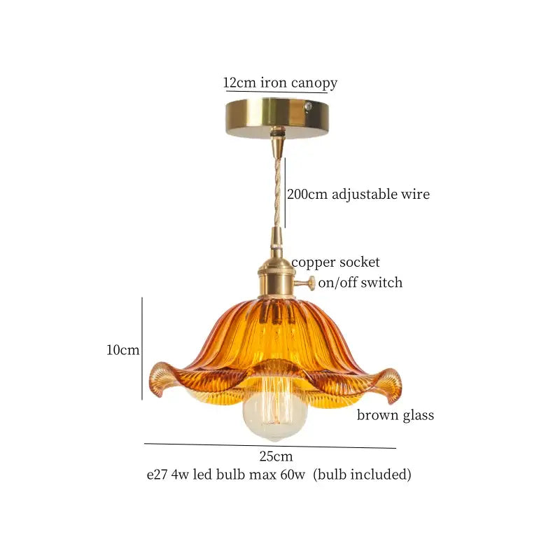 A warm amber-colored lotus leaf glass pendant light with fluted design and brass hardware by decorbites lotus leaf