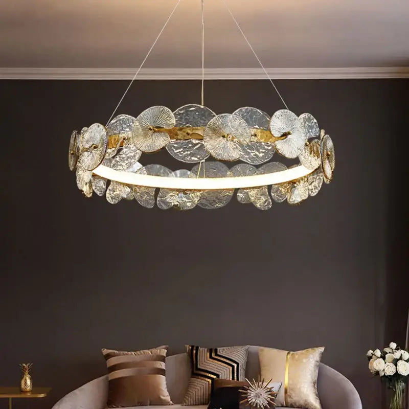 A modern decorbites lotus leaf led chandelier with translucent textured glass discs and central led light strip for living spaces