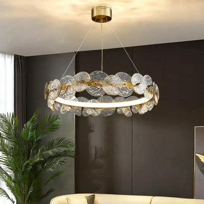 Elegant gold-toned lotus leaf led chandelier with translucent fan-shaped glass discs for modern living spaces