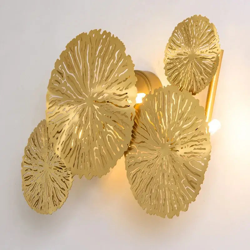Gold leaf-shaped decorbites lotus leaf wall lights with intricate radial cutouts for living room and bedroom decor