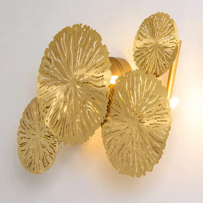 Gold leaf-shaped decorbites lotus leaf wall lights with intricate radial cutouts for living room and bedroom decor