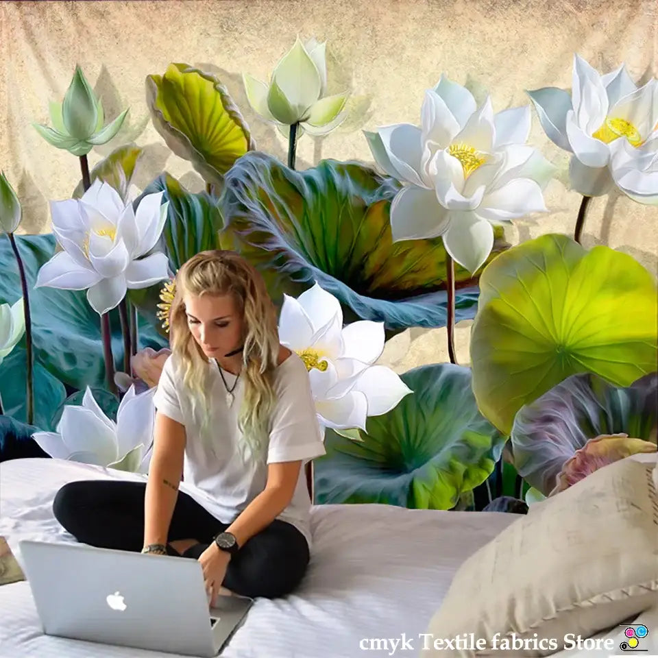 Silver apple laptop beside decorbites lotus leaf tapestry featuring indian scenery for bedroom decor