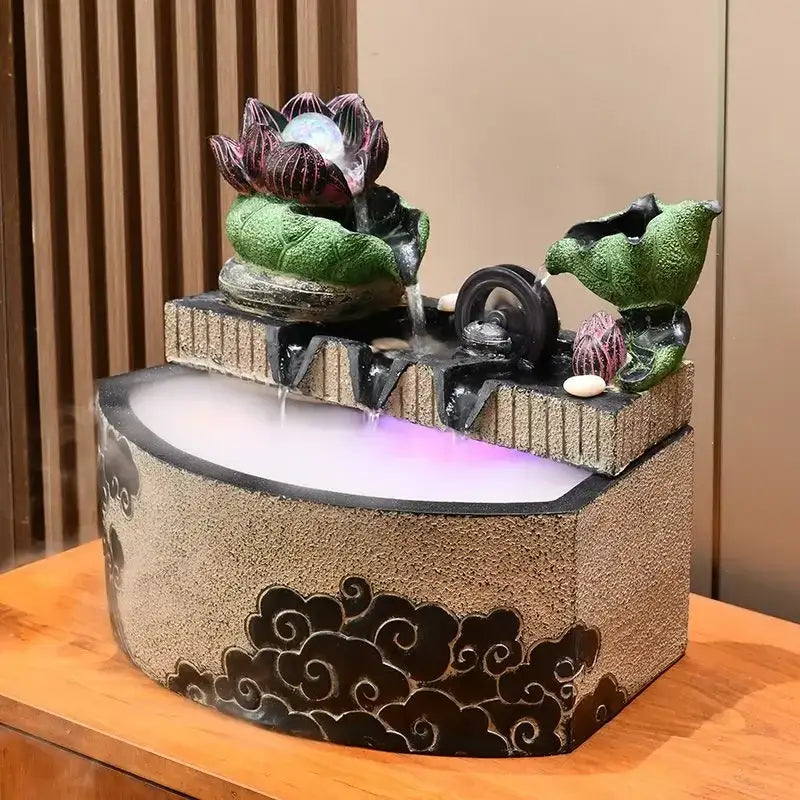 Decorbites lotus leaf water feature with purple-lit basin and lotus flower sculpture for feng shui and housewarming decor