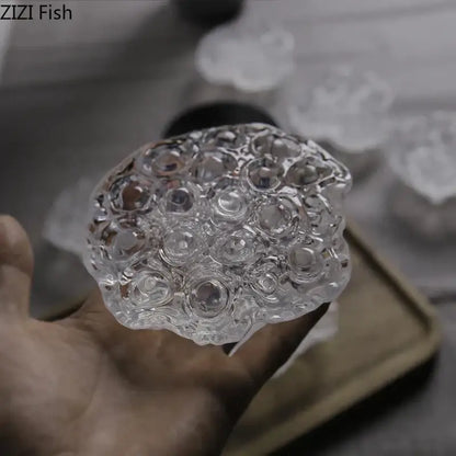 Clear glass lotus seedpod resin sculpture by decorbites featuring intricate bubble textures for modern desk decor