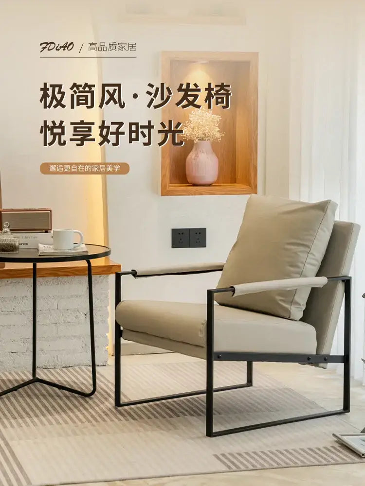 Beige upholstered decorbites lounge chair with sleek black metal frame for casual comfort in coffee shop or reception area