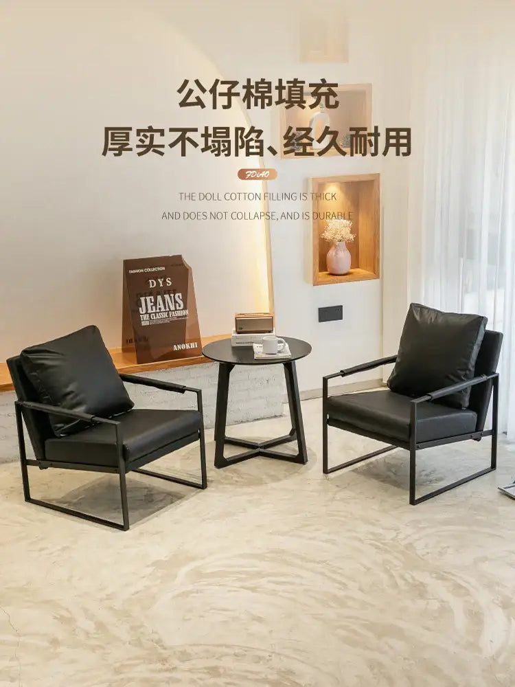 Black leather decorbites lounge chair with sleek metal frame for casual comfort in coffee shop or hotel balcony