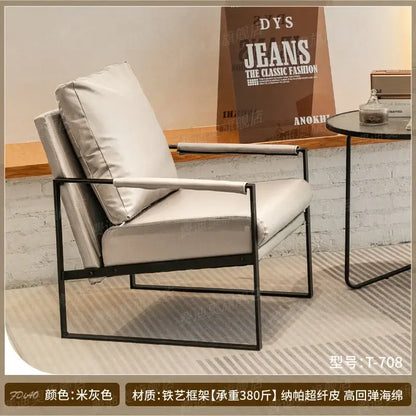 DecorBites lounge single sofa chair with black metal frame and light gray faux leather for coffee shop and hotel use