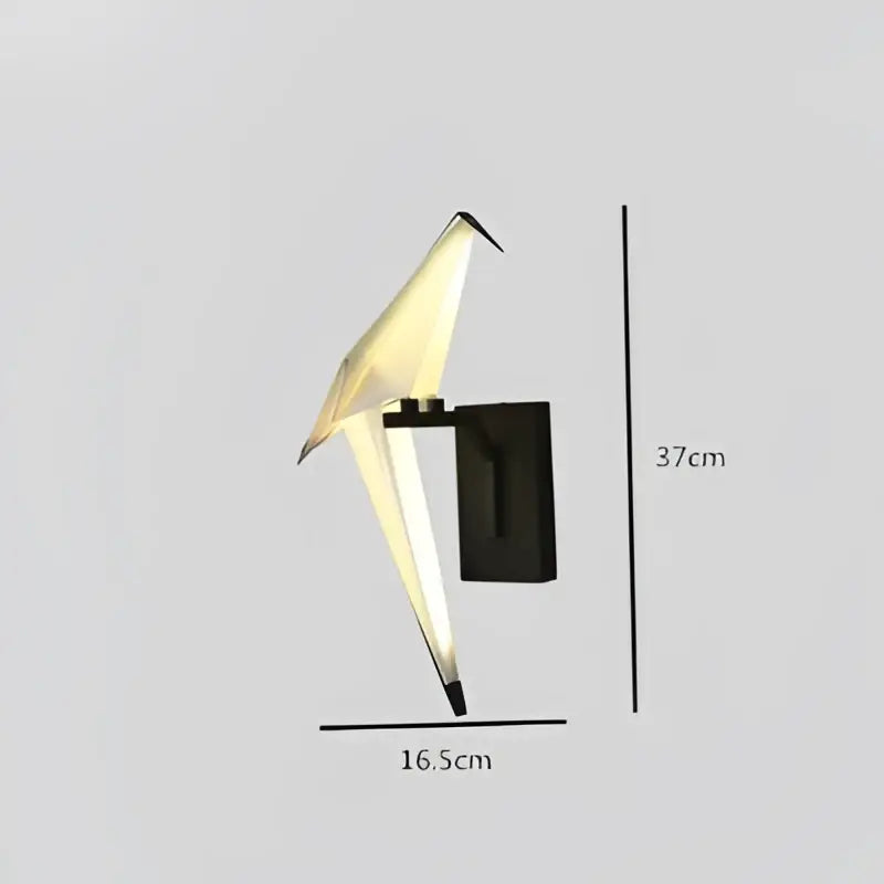 A sleek black and white origami style love bird chandelier wall sconce with glowing interior light by DecorBites Love Bird