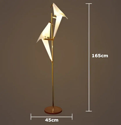 Gold-finished led wall sconce with two white origami paper wings on slender iron acryl pole for bedroom corridor