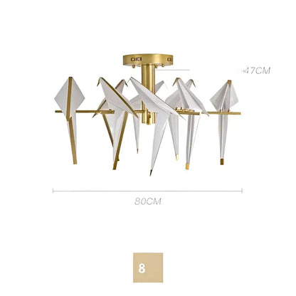Gold-toned led wall sconce with eight white origami crane wings and brass fixture for bedroom corridor lighting