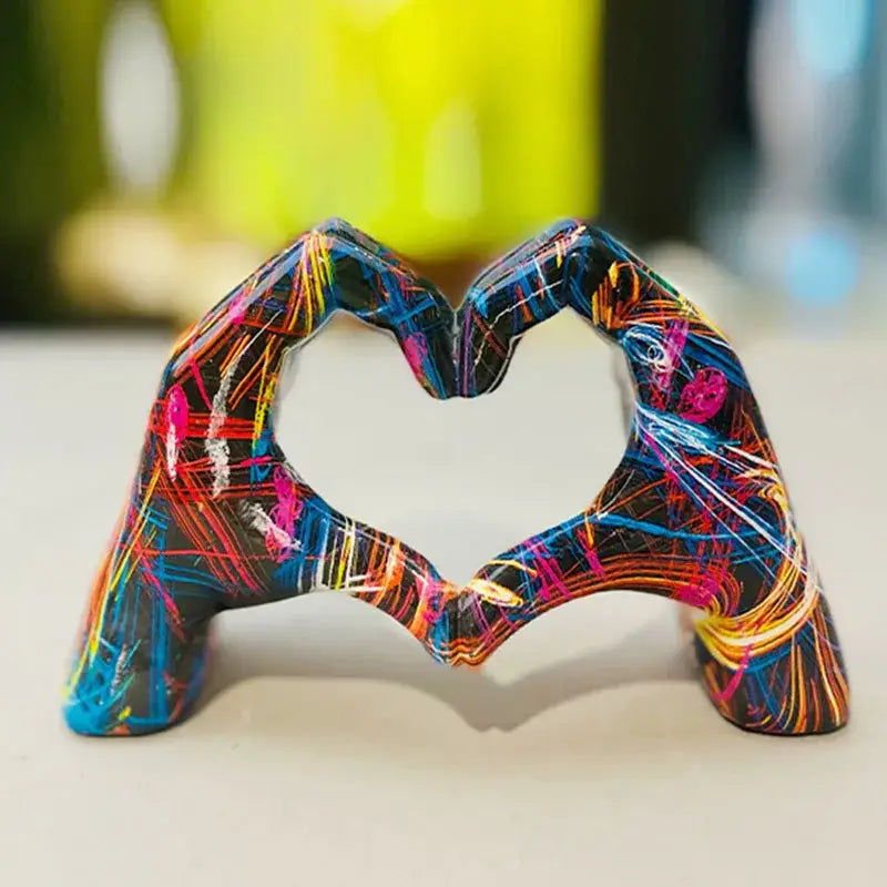 Vibrant abstractly painted resin DecorBites™ love gesture sculptures of two hands forming a heart shape pop art figurine