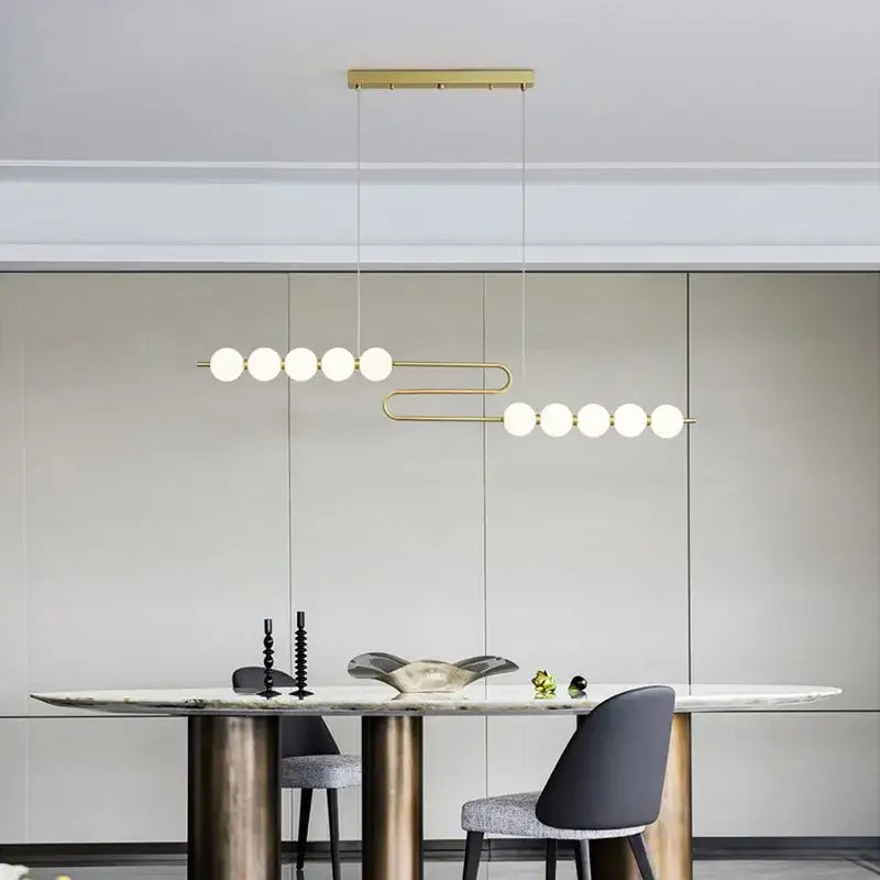 Decorbites love gold chrome chandelier featuring gold-toned pendant with frosted glass spheres for dining room lighting