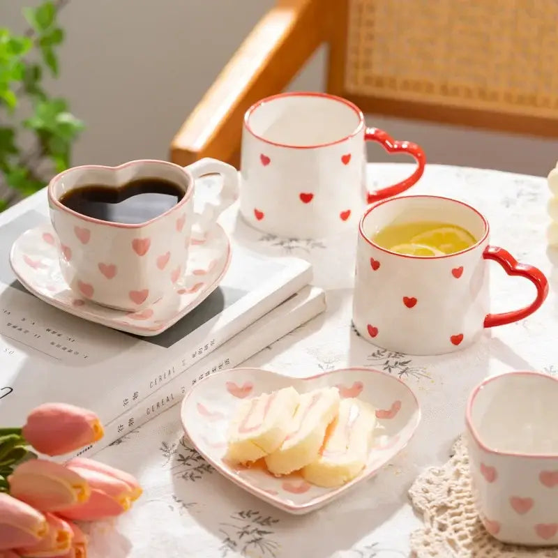 White ceramic heart hand painted mug with pink polka dots filled with coffee from decorbites love heart collection
