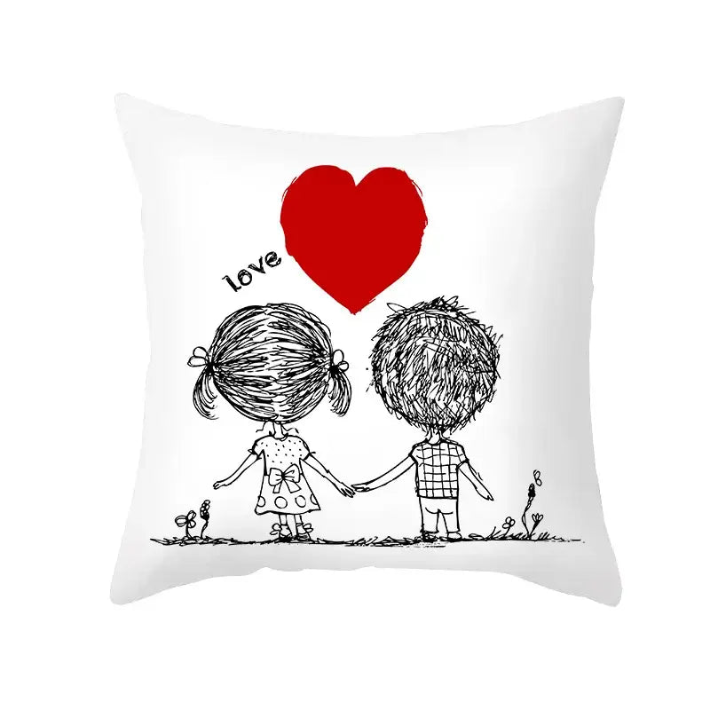 White pillow cover with black ink love heart sketch of children holding hands beneath a bold red heart design
