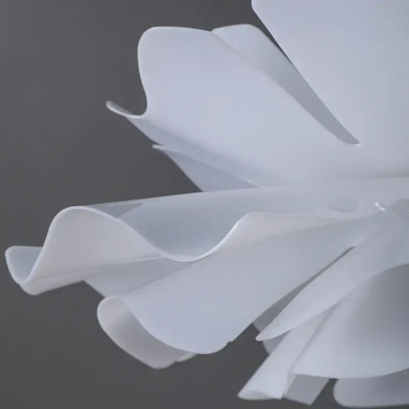 Decorbites love me not chandelier featuring a delicate simple white flower lamp with layered ruffled petals in plastic