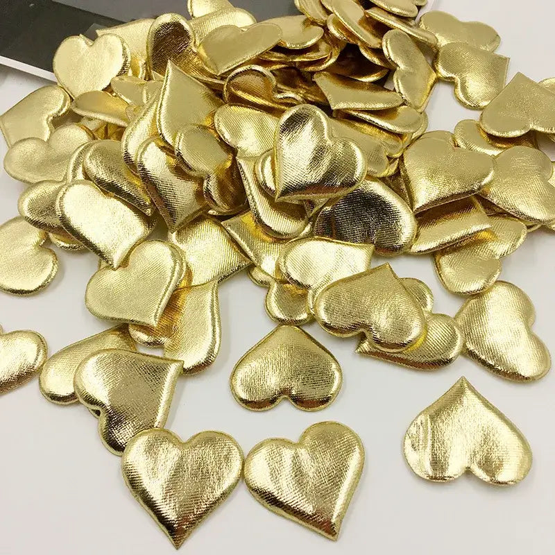 Gold heart-shaped embellishments with textured metallic finish for decorbites love petal peach wedding bouquet