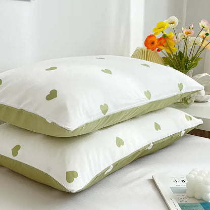 Decorbites love printed pillowcase set featuring white fabric with light green heart patterns and olive-green piping