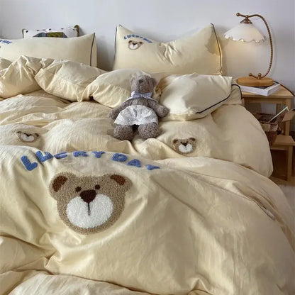Cream-colored decorbites lovely bear and sheep embroidered bedding set with plush teddy bear appliqué and blue lucky day text