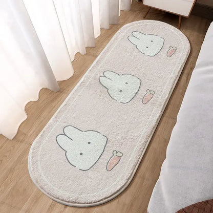 A soft off-white plush decorbites lovely rabbit pink bedside rug with three cartoon bunny faces and pink carrots
