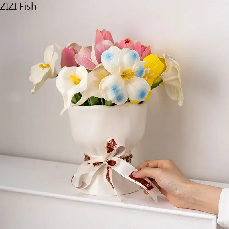 A white ceramic vase set from decorbites lovely ribbon featuring a decorative bow and colorful artificial flowers for room decor