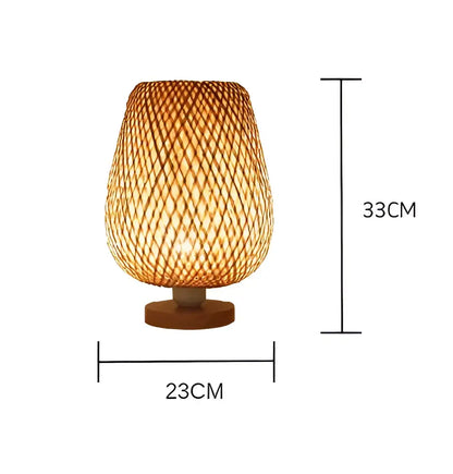A warm-toned woven bamboo floor lamp with tapered shade and wooden base from decorbites lucide colin rattan collection