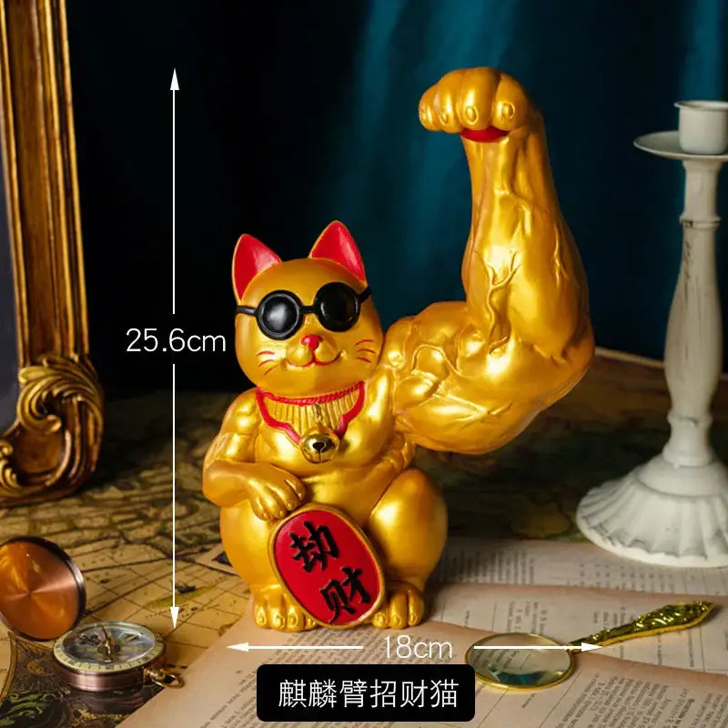 Golden decorbites lucky cat figurine with muscular arm flexing red plaque and black sunglasses for feng shui decor