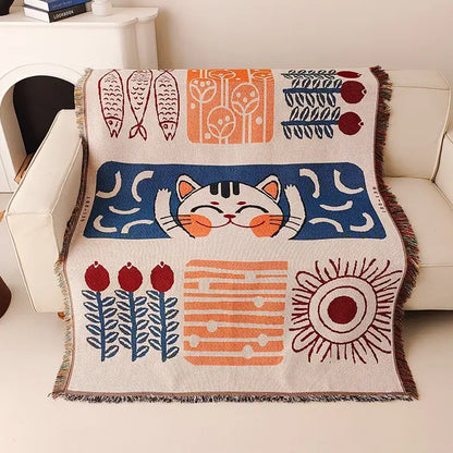 Cozy cream knitted blanket by DecorBites featuring a lucky cat design with colorful fish and sun patterns