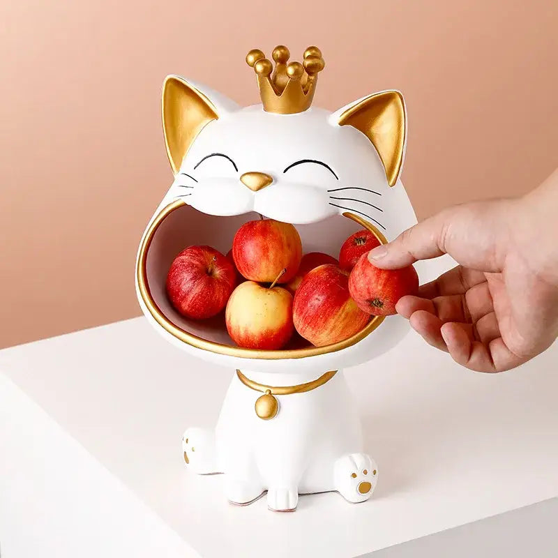 White ceramic decorbites lucky cat sculpture fruit bowl with gold crown holding red apples for modern table decor