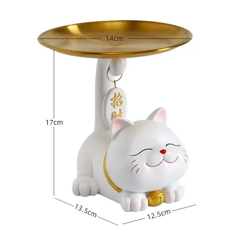 White ceramic lucky cat statue by decorbites with gold plate and bell featuring smiling face and red nose for home decor