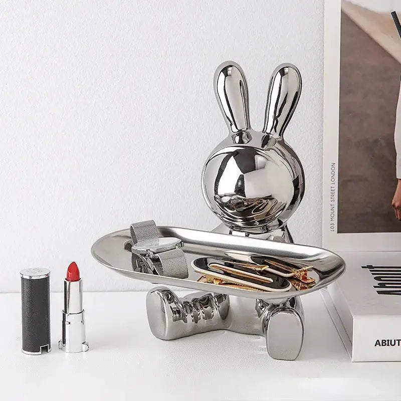 Shiny silver DecorBites lucky rabbit key tray with reflective metallic finish and flat oval serving surface for organization