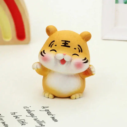 Cute yellow lucky tiger figurine with white belly and pink cheeks featuring a smiling face and chinese characters