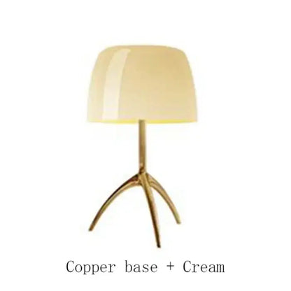 Cream-colored glossy lampshade on copper tripod base in decorbites lumiere glass table modern glass table lamp