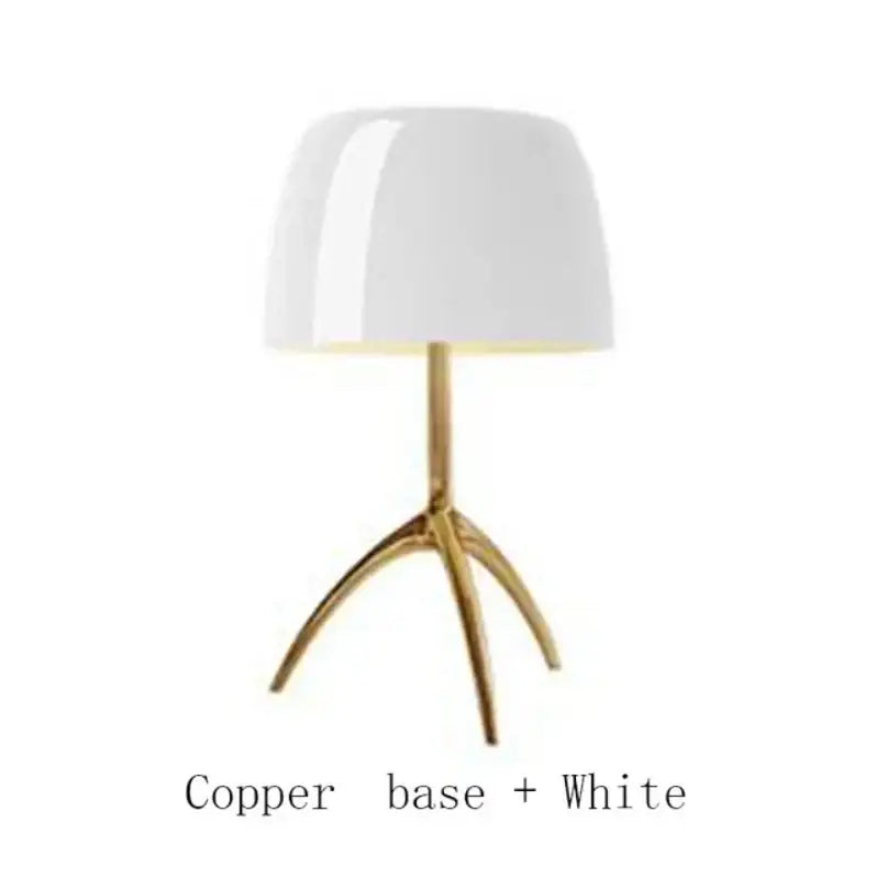 A sleek white lampshade on a polished copper tripod base of the decorbites lumiere table lamp for modern interiors