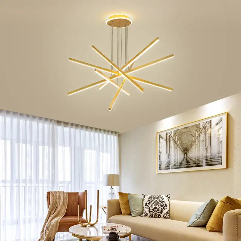 Modern gold-toned decorbites luminous ceiling plate chandelier with starburst aluminum arms for living room lighting