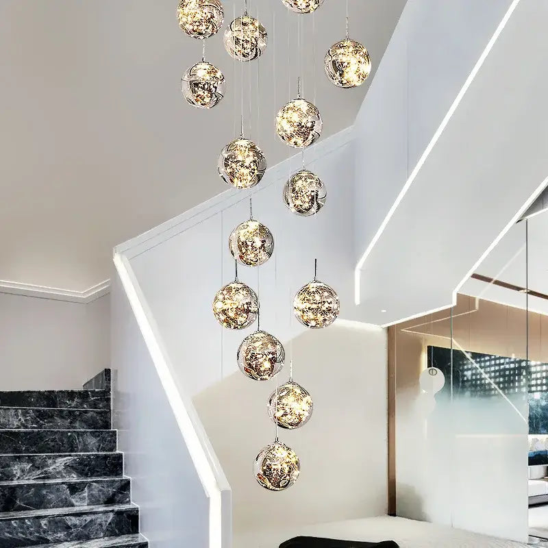A decorbites luminous glass ball pendant chandelier with reflective metallic interiors and warm led lighting for living rooms