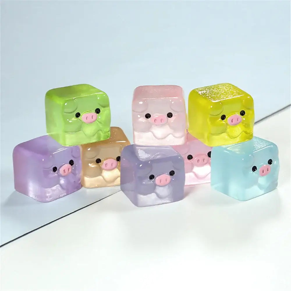 Colorful translucent cube-shaped pig figurines with pink snouts in decorbites luminous resin cactus miniatures set